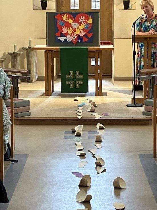 A trail of paper footsteps leading up the aisle of St Paul's to the altar